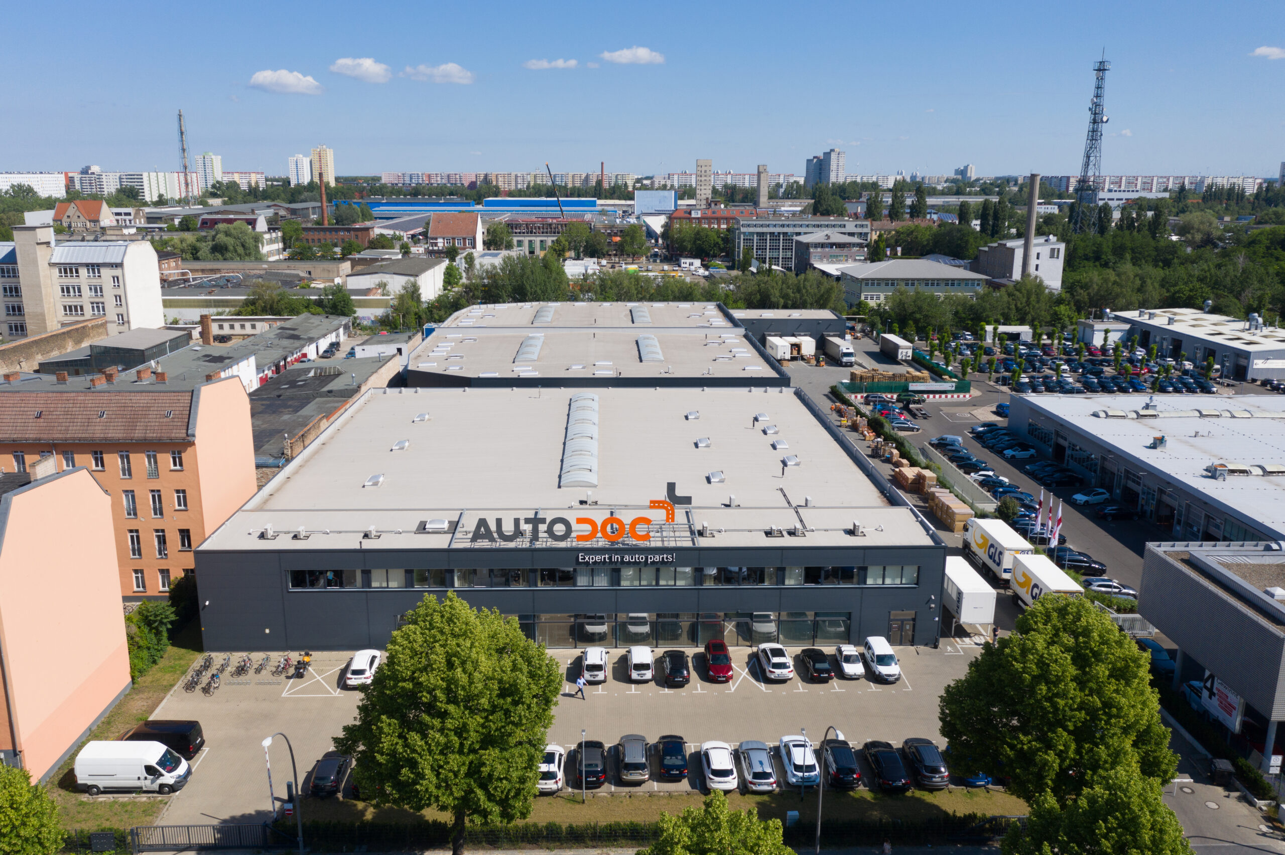 A building with cars parked in front of it, where Warehouse is located